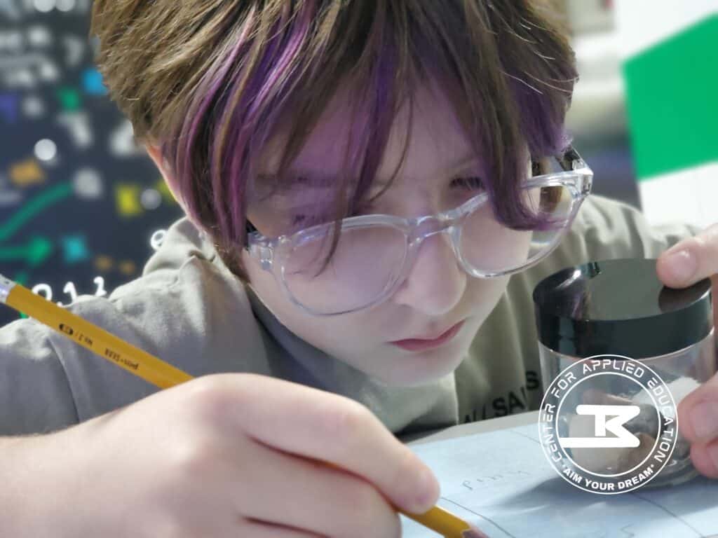 Innovative student engaged in scientific research, analyzing data with a magnifying glass and writing notes, inspired by Big Brainbox.